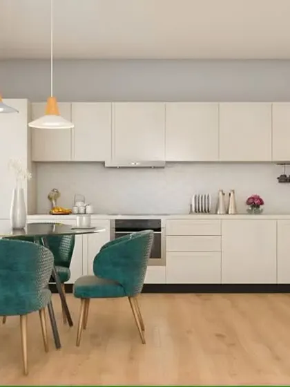 This open-plan space features a straight kitchen that blends seamlessly with the dining area. The all-white cabinets and light wood flooring create a bright, Scandinavian-inspired look.