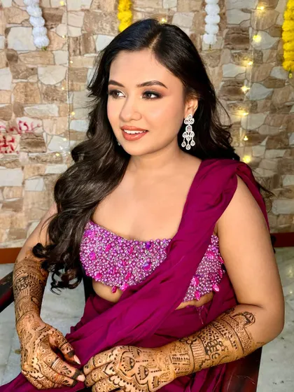 My pretty Mehendi bride in a vibrant magenta outfit. The makeup is soft and glamorous, with a neutral eye and a warm lip color to balance the bright ensemble.