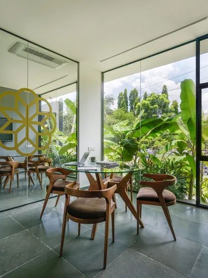 Even our meeting rooms are designed to be connected to the outdoors. This discussion room at Soul Spring features a floor-to-ceiling window that looks out onto a dense garden, providing a calming and inspiring backdrop for conversations.