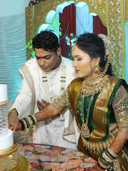 The cake cutting ceremony is a highlight of any celebration. Here, the couple cuts their beautiful swan-themed engagement cake together.