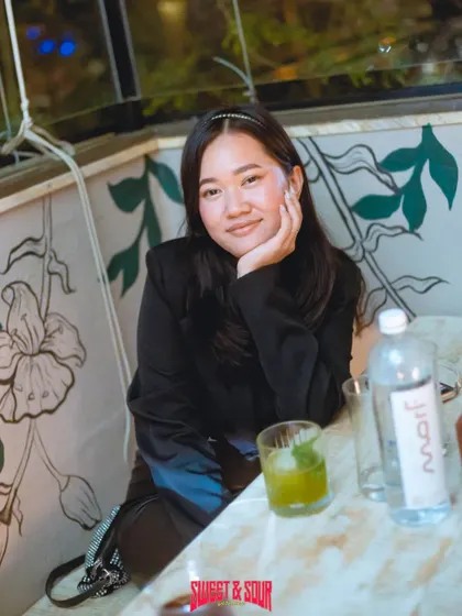 A guest enjoying the chill vibe at our rooftop party. It's a perfect spot to unwind.