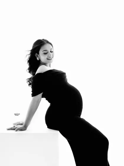 The black and white version of this pose creates a beautiful, high-contrast silhouette that is both artistic and elegant.