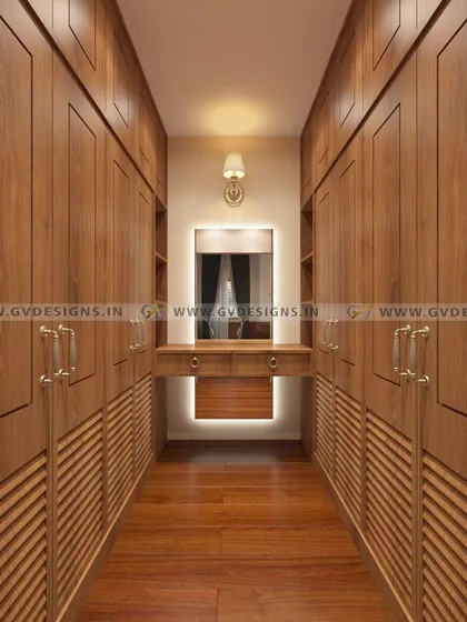 A walk-in closet is a statement of personal luxury and organization. We designed this classic closet with floor-to-ceiling teakwood wardrobes, antique-finish handles, and a central dressing unit with integrated lighting to create a functional and timelessly elegant space.