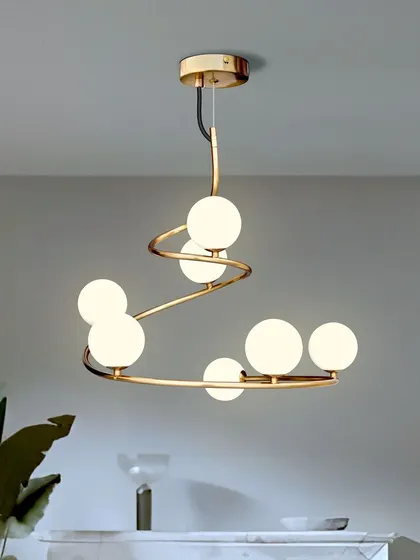 Another view of the spiral globe chandelier, showing its warm and inviting glow. It's a versatile piece that fits well in many different interior styles.