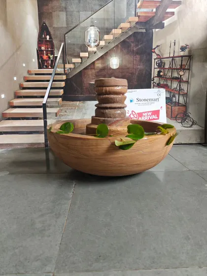 The clean, simple lines of the bowl and the intricate carving of the center piece make this a versatile modern fountain.
