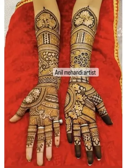 A beautiful, symmetrical design with heart-shaped frames and peacock heads. The palms are filled with intricate floral and paisley patterns.