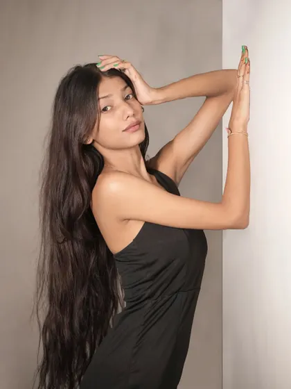 A duplicate of image 77, this artistic pose with raised arms creates elegant lines and a sense of drama.