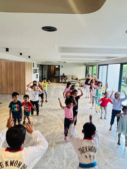 A fun warm-up session with the younger kids, getting them excited and ready for class.