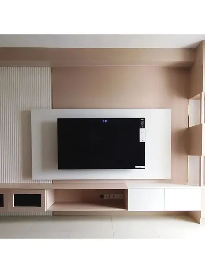 This modern, wall-mounted TV and entertainment unit combines form and function. It features a mix of open and closed storage, including display niches and a floating console, all illuminated by soft, integrated LED lighting.