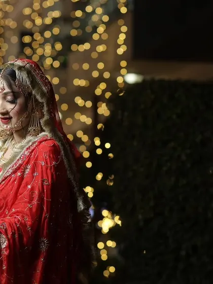 A soft, elegant portrait of the bride. Her gentle smile and the beautiful lighting create a timeless and graceful image.