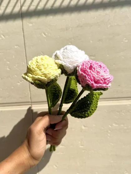 A simple and sweet trio of handmade crochet roses in yellow, white, and pink. These single stems are perfect for a small vase or for creating your own custom arrangement.