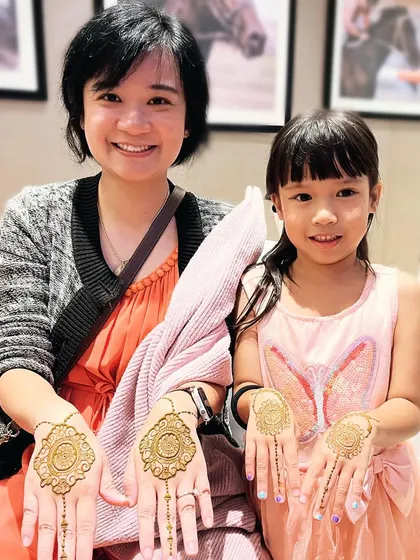 A beautiful mother-daughter duo from abroad enjoying their matching mandala mehndi designs. It's always special to create these shared memories for families.