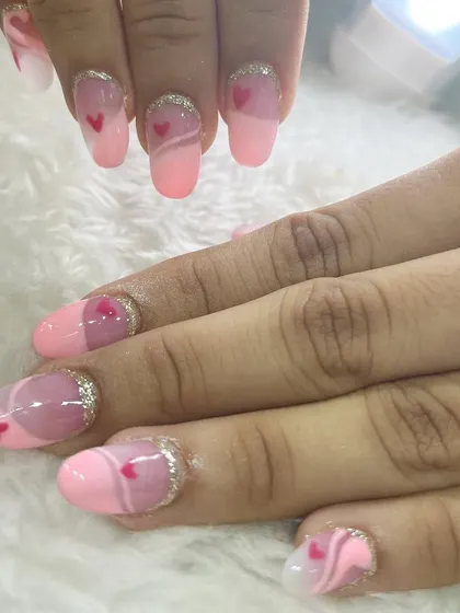 A cute and romantic heart-themed nail set created by one of our students. This showcases their ability to execute themed designs with precision.