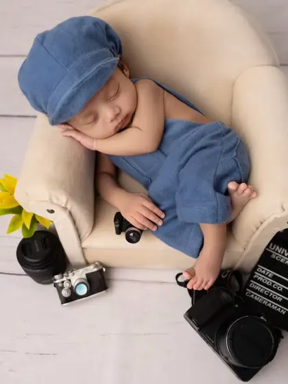 A full view of the adorable movie-themed setup. I provide all the props and outfits to make your newborn's first photoshoot extra special.