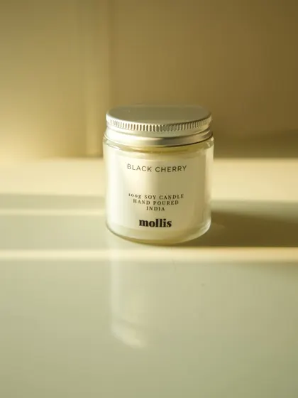 A single 100g Black Cherry scented candle, perfect for a dresser or bathroom.