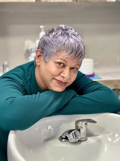 The versatility of silver hair. Here my client is leaning over the wash basin, showing how the color catches the light from every angle.