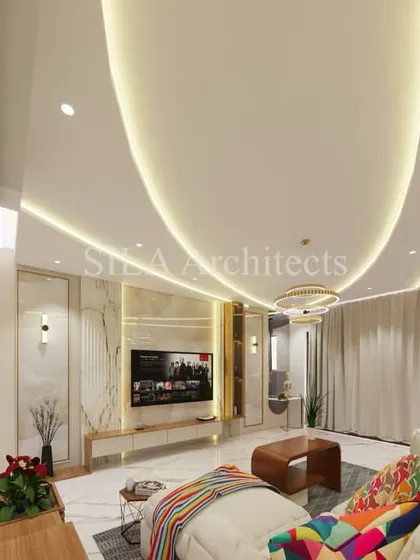 We design living spaces that are both luxurious and livable. This 3D rendering shows a spacious living room with high ceilings, elegant lighting, and a seamless flow into the dining and kitchen areas, creating an atmosphere of open, modern comfort.