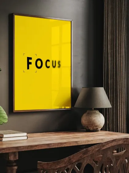 Our "FOCUS" print in a dark, moody study. The bright yellow provides a stunning pop of color, while the simple frame ensures the message remains the center of attention.