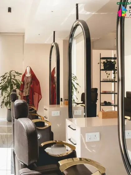 The styling stations are bathed in natural light from large windows, creating a bright and pleasant environment for both stylists and clients.