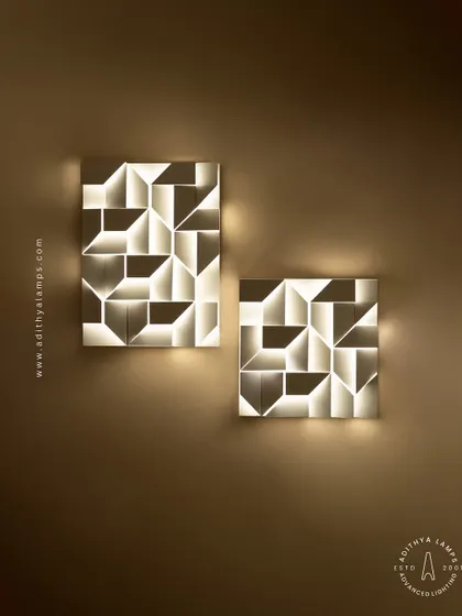 This 3D geometric wall light plays with light and shadow. The puzzle-like arrangement of white panels creates pockets of light, turning a simple wall into a dynamic feature. It is a perfect piece of illuminated wall art.