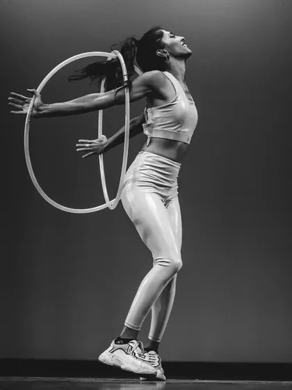 The feeling of pure joy and expression on stage with my twin hoops. This black and white photo really captures the emotion of the performance for me.