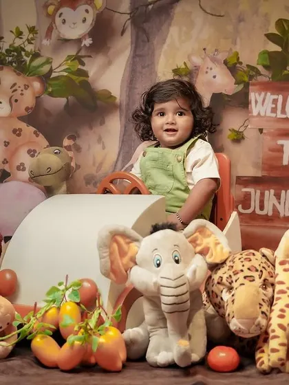 Another example of a themed kids' photoshoot, this time with a 'Welcome to the Jungle' setup. These sessions are all about fun and capturing your child's personality in a playful environment.