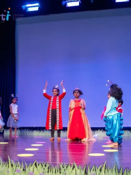 The Queen of Hearts and her court on stage during our "Alice in Wonderland" production. The elaborate costumes and confident performances made the show a huge success.