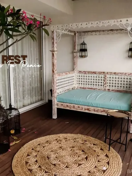 We create cozy corners for peace and relaxation. This custom outdoor daybed, built with durable wood and intricate details, turns a simple balcony into a private escape.