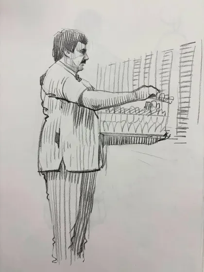 A sketch of a vendor at his stall, focusing on the upper body and posture.