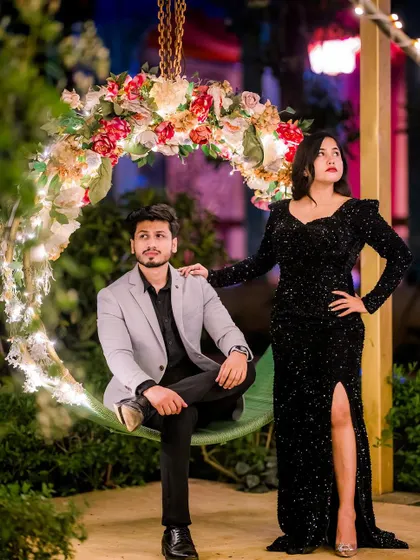 A very stylish pre-wedding shoot with a glamorous vibe. The bride-to-be is wearing a full-sequin black bodycon gown with a high slit, paired with his sharp grey blazer.