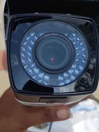 A close-up of the lens and infrared LEDs on a Hikvision bullet camera, which are essential for night vision.