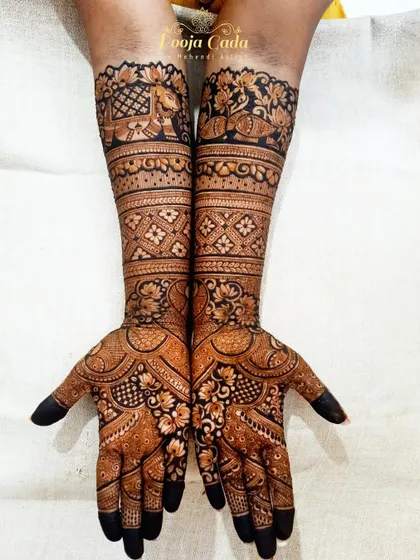 A traditional bridal design without human figures, focusing on intricate floral and paisley patterns with elephant and peacock borders.