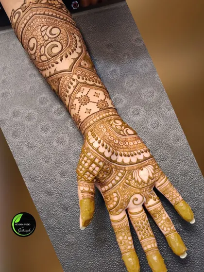 A single arm shot showing the excellent stain quality on a complex, full-arm design.