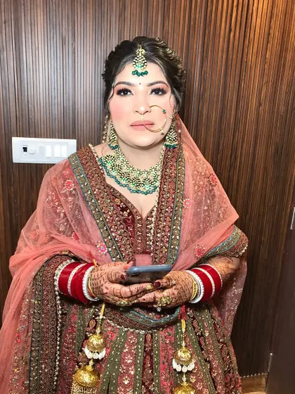 The full bridal look, complete with kaleeras and a beautiful smile.