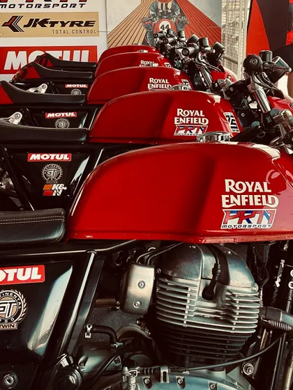 A lineup of our Royal Enfield bikes, stickered and ready for the track. We take pride in our fleet, ensuring every bike is in top condition.