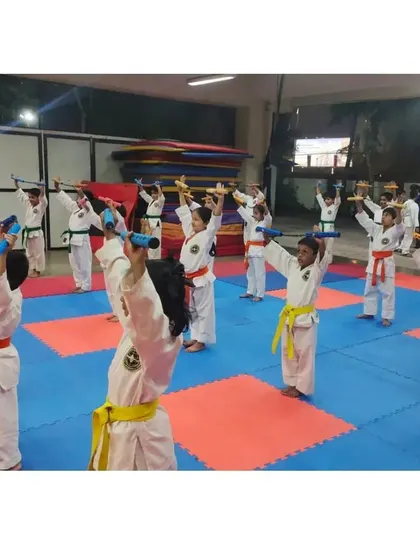 Another angle of our Nunchaku session, showing the concentration of our young students as they learn to handle the weapon.