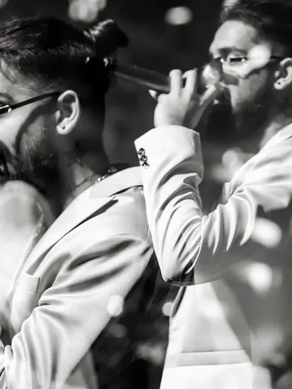 A creative black and white shot of our vocalists. It captures the motion and energy of our live performances.