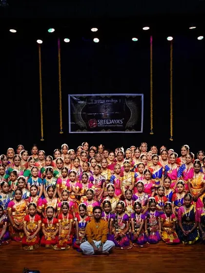 This is my family. Seeing all my students together for Nrithya Sandhya fills my heart with oru santhosham, a unique happiness. From the youngest beginners to the senior performers, this is the result of our shared passion.