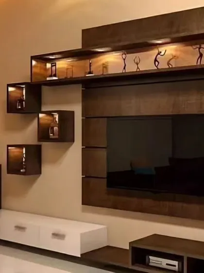 This entertainment unit uses dark wood and illuminated display boxes to create a dramatic effect. It's perfect for showcasing trophies or art pieces.