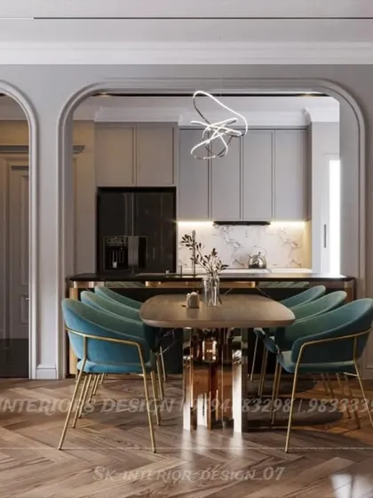This view shows how an arched opening can beautifully frame the dining and kitchen area. The design uses consistent materials and colors to create a harmonious flow between the different zones.