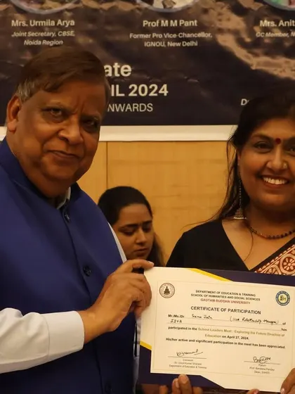 Another one of our mentors receiving a certificate at an education summit. We are proud of our team's recognition and their role as leaders in educational reform.
