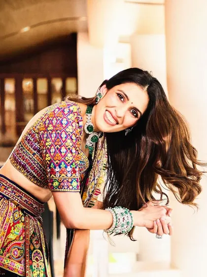 A joyful shot that captures the energy of this colorful lehenga. Styling is about matching the outfit to the client's personality, and this look is pure happiness.