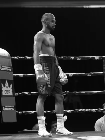 Before the punch comes belief. A quiet moment of focus for a fighter in the ring before the bell rings.