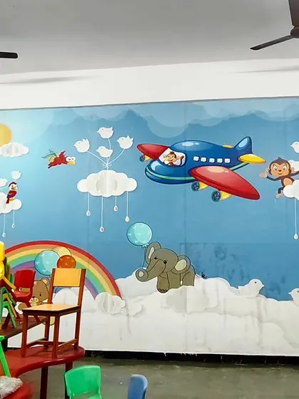 I enjoy brightening up spaces for children, like this cheerful mural in a school. The colorful design with airplanes, clouds, and animals creates a fun and imaginative atmosphere perfect for a learning environment.
