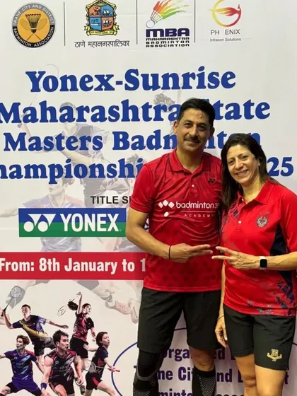 Posing for a photo after a successful mixed doubles match at the Thane Senior Masters Championship.