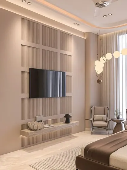 A cozy bedroom featuring limewash walls, a paneled TV unit with integrated shelving, and a modern bubble chandelier. The soft, warm textures and neutral tones create a serene and timeless space.