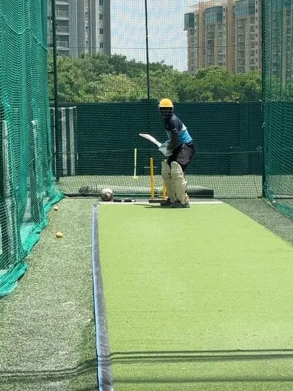 A batsman takes his stance in the nets. Every session is a work in progress, a step towards perfection.