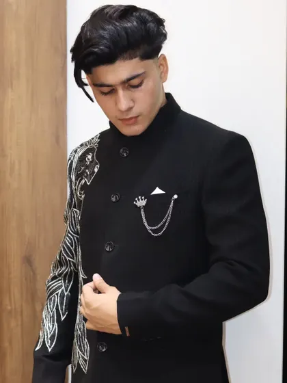 Another angle of my signature lion-embroidered bandhgala. The design flows from the shoulder down the sleeve, creating a powerful and unique look.