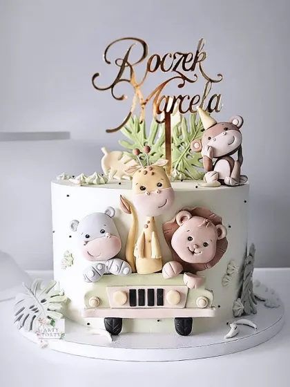 A safari-themed cake with adorable animals taking a ride in a jeep. This design is perfect for a child's birthday and showcases fun storytelling through cake.
