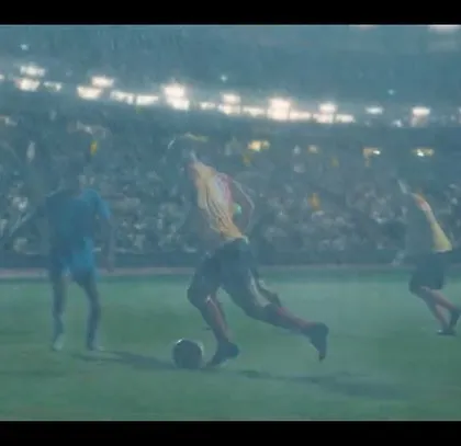 Another dynamic action shot from the East Bengal FC ad, capturing the intensity of the match in the rain.